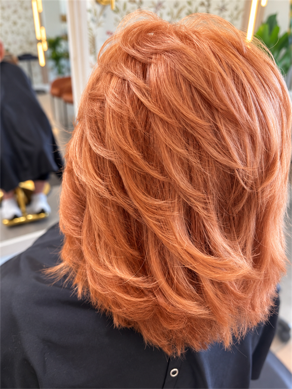 Layered copper hair color created at In Vision Hair Design